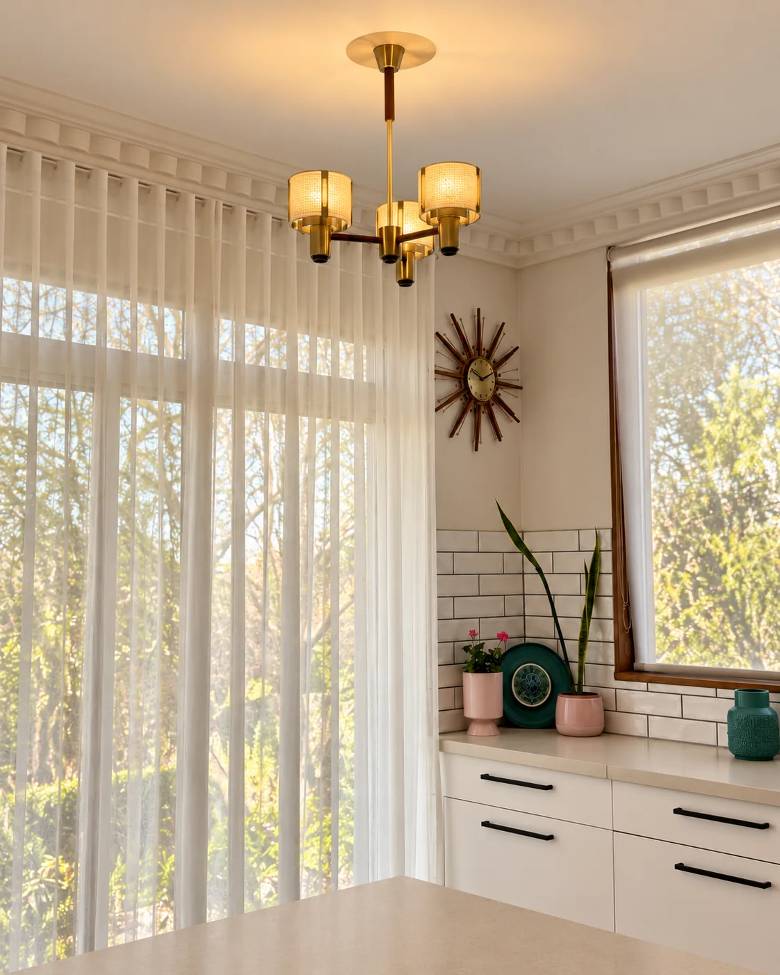 Decorative pendant light installed over a kitchen